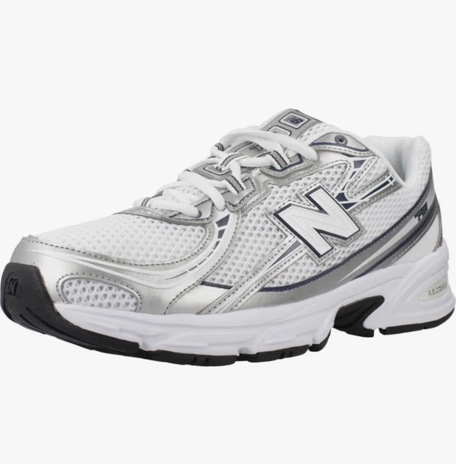 Zapatilla New Balance 740 unisex blanca y plateada con detalles oscuros